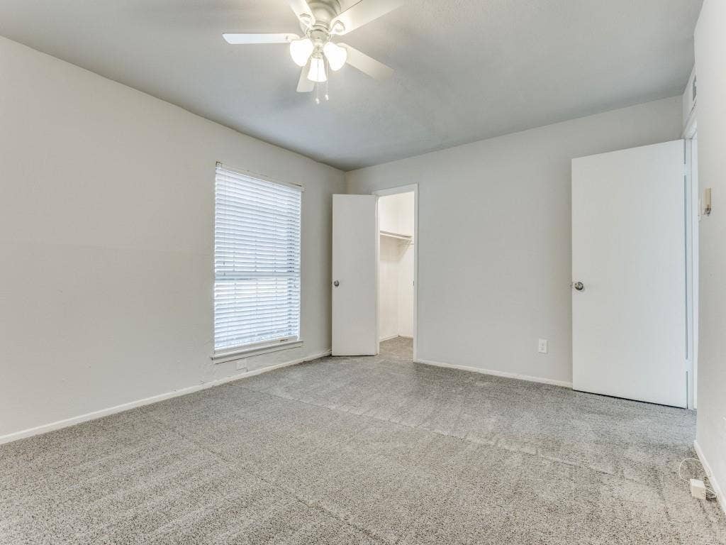 12888 Montfort Drive, #155, Dallas, TX 75230 Spacious room featuring neutral carpeting and light-colored walls