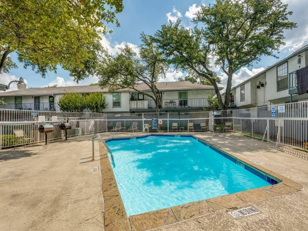 12888 Montfort Drive, #155, Dallas, TX 75230 Rectangular swimming pool with a concrete surround and textured coping