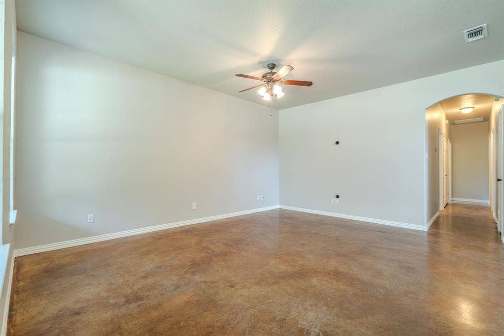 403 Summer Tree Lane, Springtown, TX 76082 Living room featuring ceiling fan, fresh paint and hallway