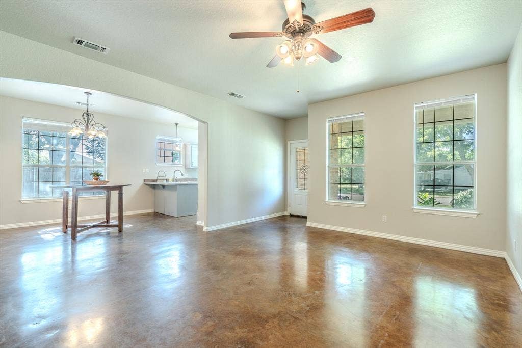 403 Summer Tree Lane, Springtown, TX 76082 Living room and dining area featuring an open floor plan.