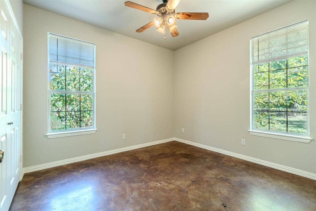 403 Summer Tree Lane, Springtown, TX 76082 Bedroom featuring a ceiling fan and fresh paint