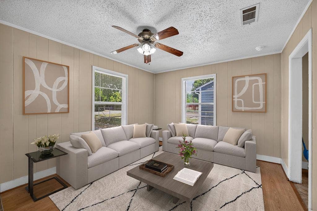 4450 Percy Street, Lancaster, TX 75134 Living space with neutral-toned vertical paneling and white trim