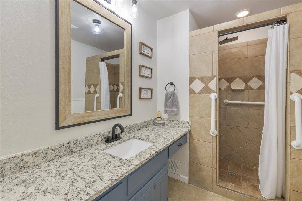 323 Dyer Circle, Payne Springs, TX 75156 Bathroom vanity with granite-style countertop and undermount sink