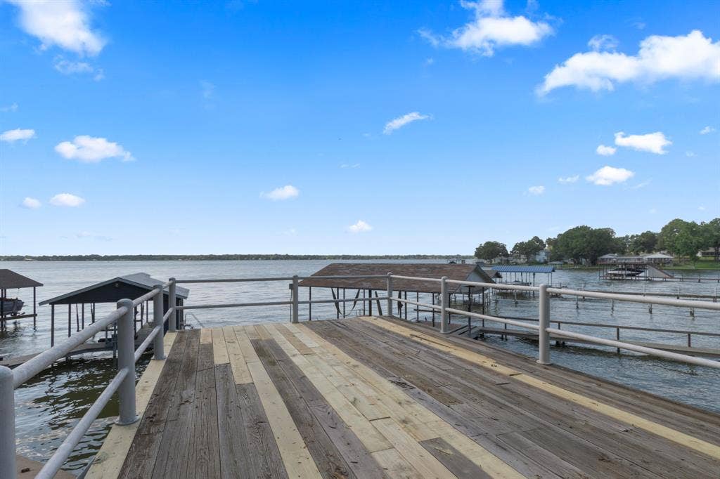 323 Dyer Circle, Payne Springs, TX 75156 Private boat dock with wood-finish decking and metal railings