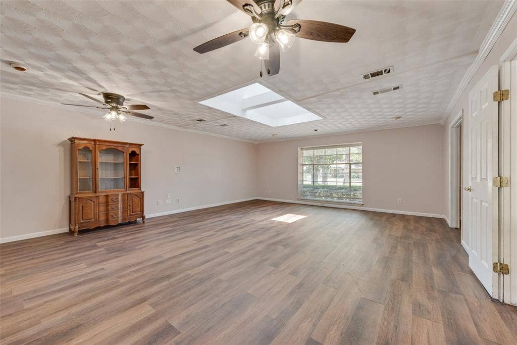 Oversized living room with a lot of natural light