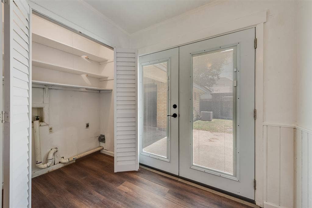 Laundry closet with pantry above and doors leading to backyard patio