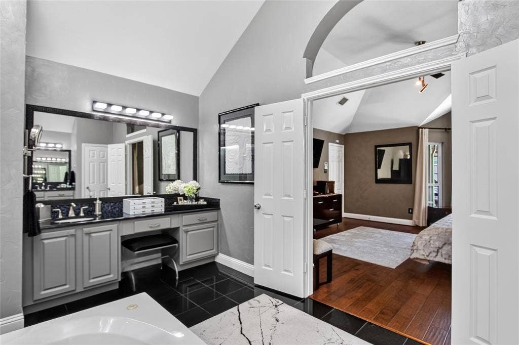 4243 Millview Lane, Dallas, TX 75287 View of one of two vanities and entrance to primary suite. This primary bathroom maybe as large as the Primary bedroom.