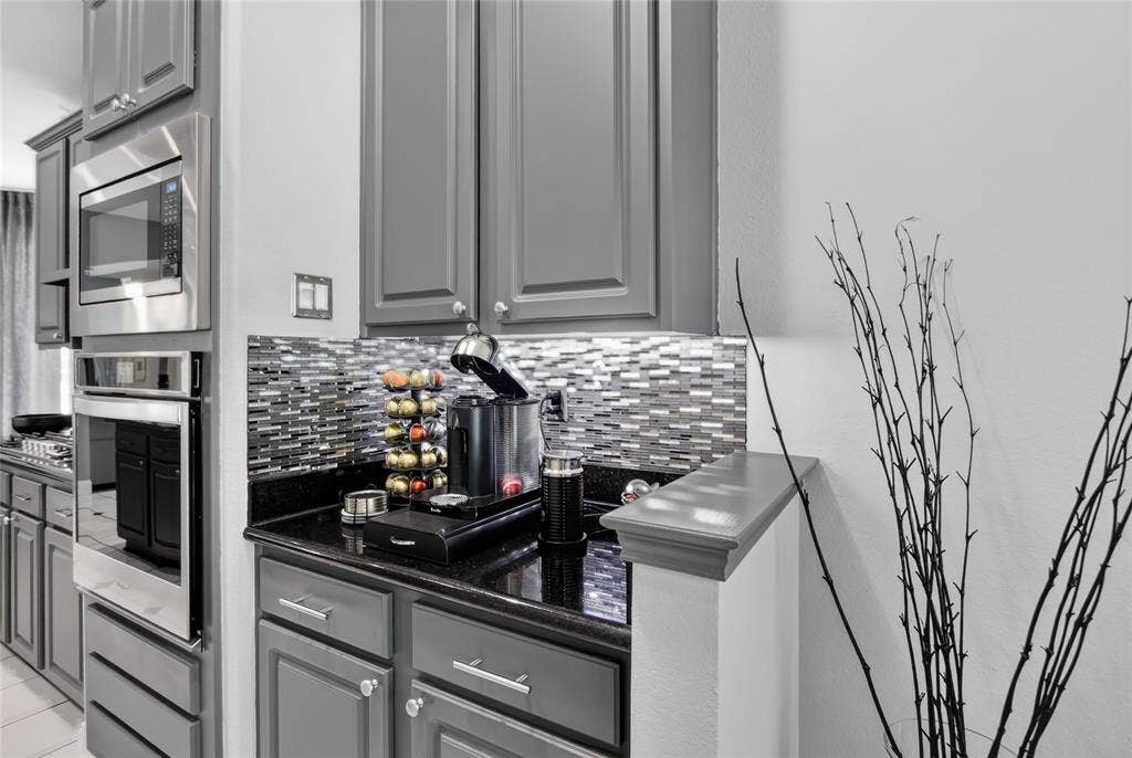 4243 Millview Lane, Dallas, TX 75287 Thoughtfully designed dry bar or coffee station is conveniently located just off the kitchen, directly across from the pantry. Versatile space is an ideal area for staging dinnerware and serving pieces making entertaining effortless as the dining area is just a few feet away.