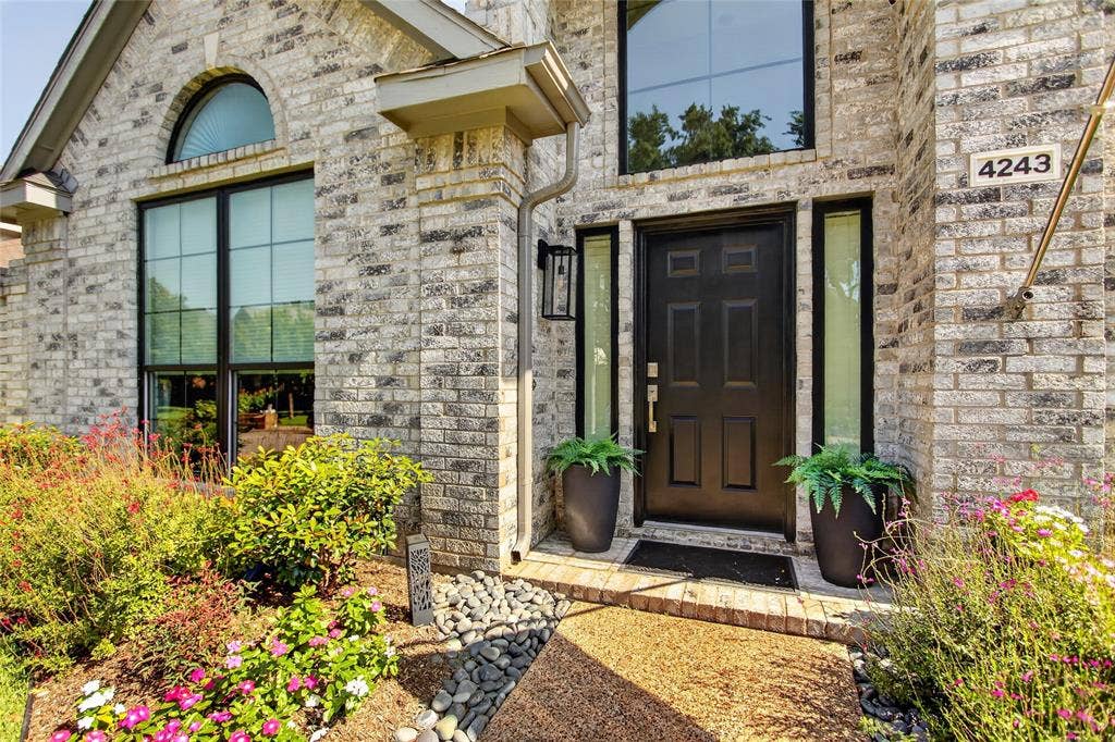 4243 Millview Lane, Dallas, TX 75287 Beautifully maintained flower beds filled with seasonal color creating a picture perfect first impression.