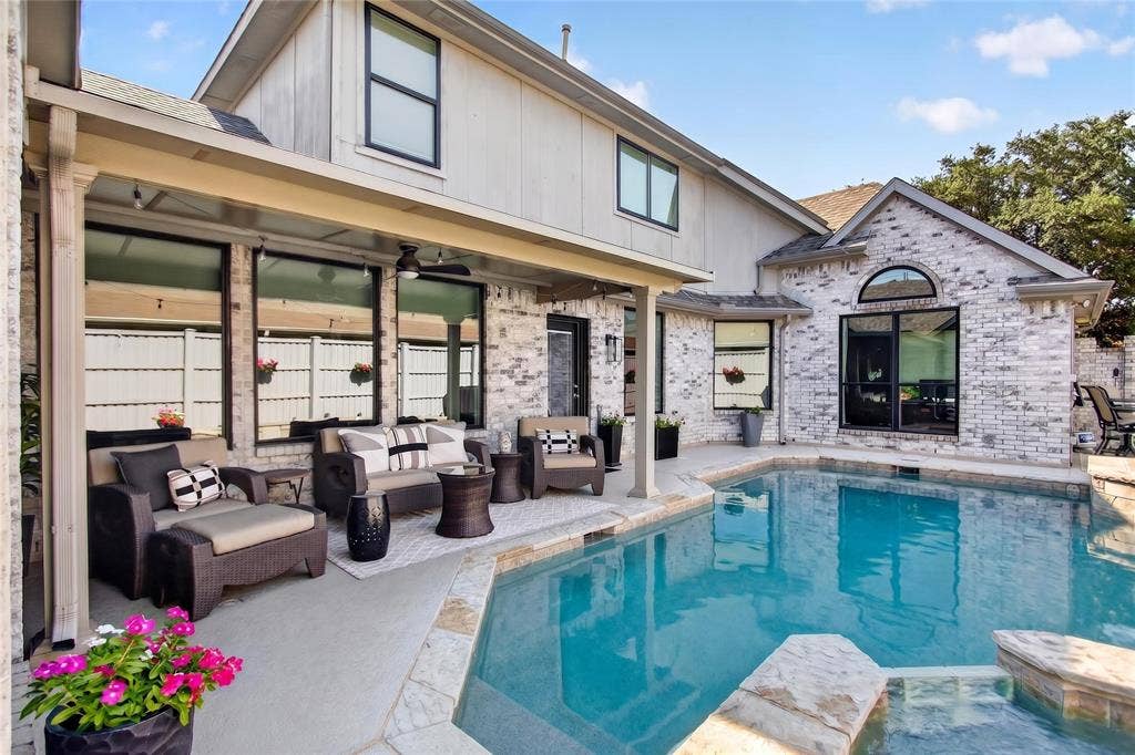 4243 Millview Lane, Dallas, TX 75287 Step outside to a resort style backyard designed for both relaxation and entertaining. A spacious covered patio with fans and lights has ample space for multiple seating arrangements