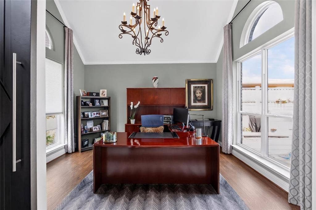 4243 Millview Lane, Dallas, TX 75287 Home office has plenty of natural light with floor to ceiling windows looking out the front as well as out to your pool. Wood floors installed in office, dining and living room in 2007. Neutral color walls accents most furniture. Check out this statement light fixture!