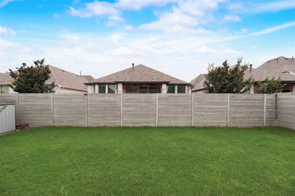 View of fenced backyard