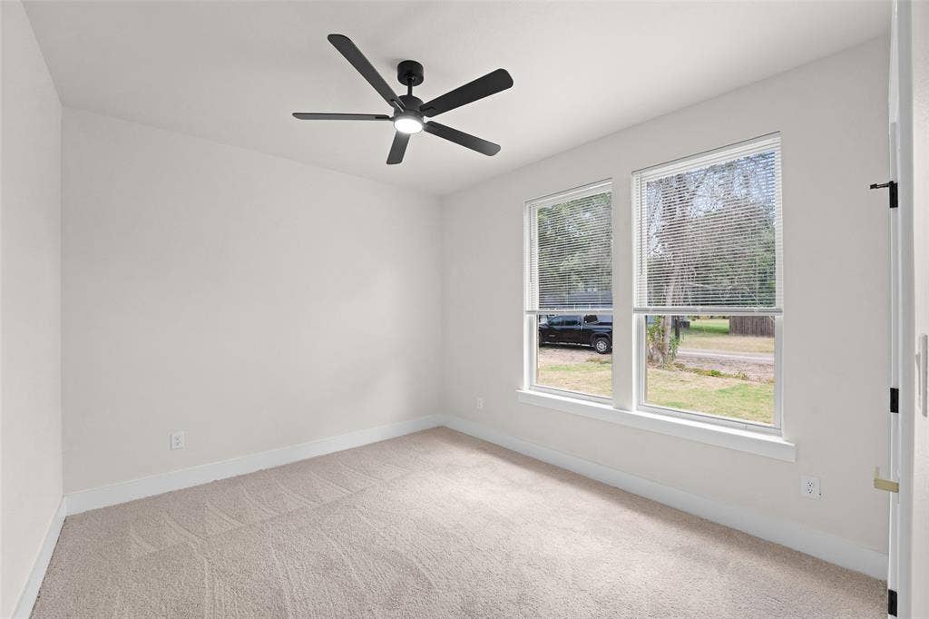 609 Luzon Street, Tool, TX 75143 Neutral tone walls with white trim throughout