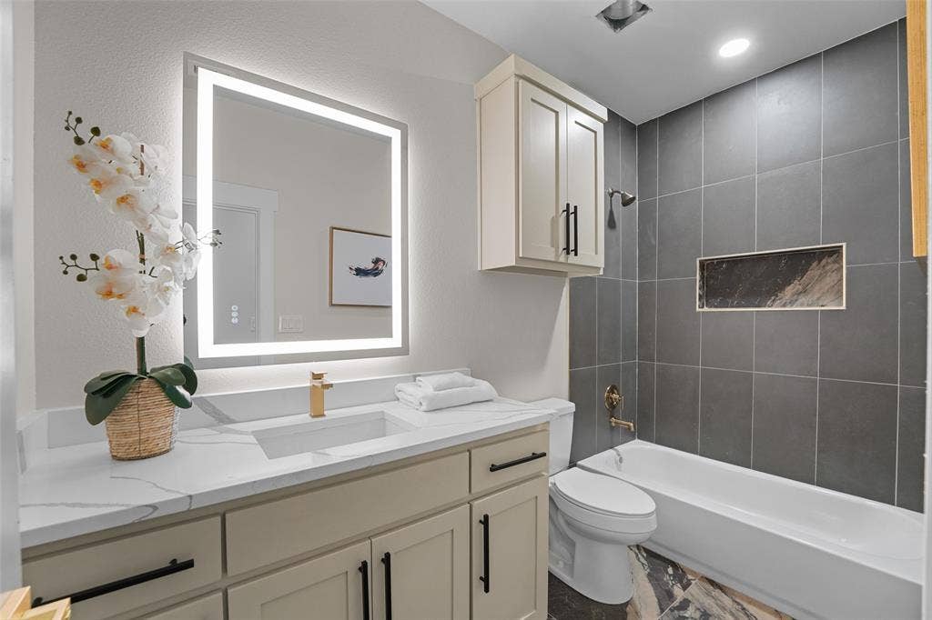 609 Luzon Street, Tool, TX 75143 Contemporary bathroom featuring an illuminated vanity mirror