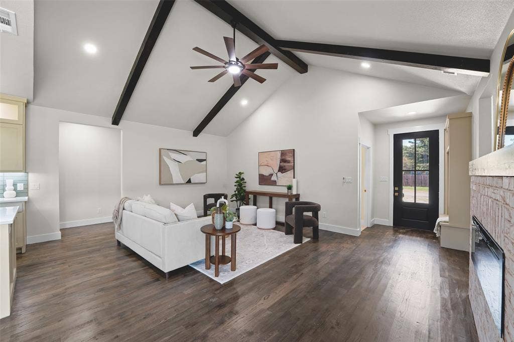 609 Luzon Street, Tool, TX 75143 Living area featuring a vaulted ceiling with exposed dark wood beams, wood-finish flooring, recessed lighting, and a dark wood ceiling fan