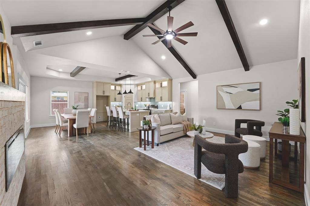 609 Luzon Street, Tool, TX 75143 Spacious interior featuring wood-finish flooring, vaulted ceilings with exposed beams, recessed lighting, and a modern ceiling fan