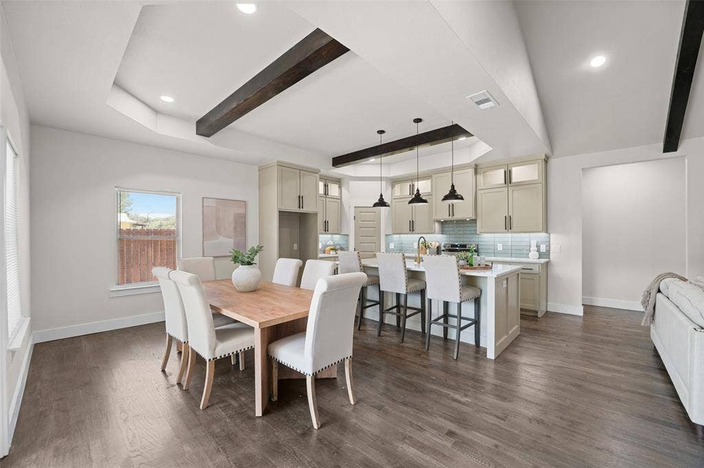 609 Luzon Street, Tool, TX 75143 Open-concept living space featuring wood-finish flooring, a tray ceiling with exposed beams, and recessed lighting
