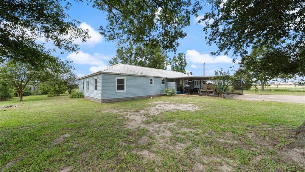 1053 Vz County Road 4206, Athens, TX 75752 Light blue siding exterior with a metal roof