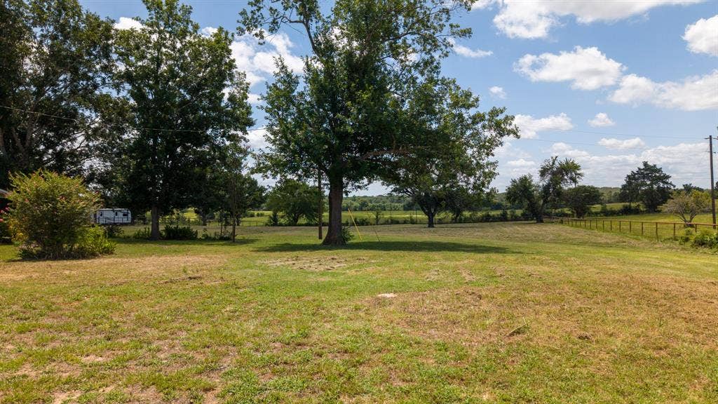 1053 Vz County Road 4206, Athens, TX 75752 Expansive open field with scattered mature trees and partial perimeter fencing