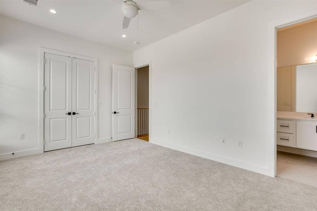 123 Thornton Street, Arlington, TX 76013 Neutral-toned carpeting paired with white walls, a white ceiling fan, and recessed lighting