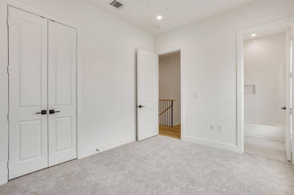 123 Thornton Street, Arlington, TX 76013 Spacious room with light gray carpet, recessed lighting, white walls, and white trim