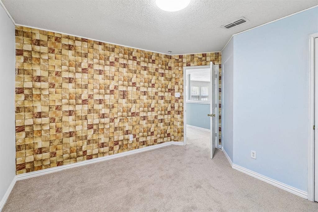 503 Angela Lane, Euless, TX 76039 Spacious Bedroom with Wallpaper