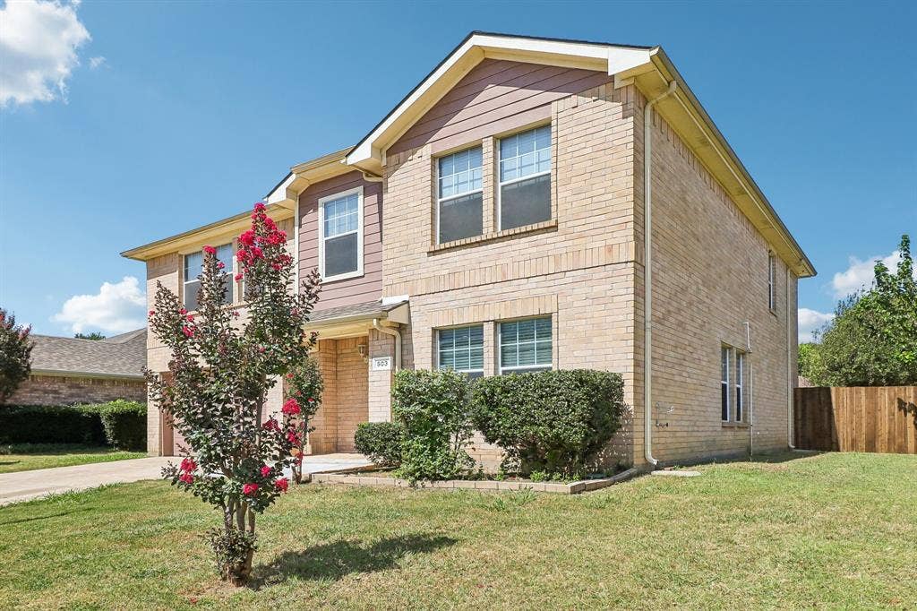 503 Angela Lane, Euless, TX 76039 Front of home with large side yard