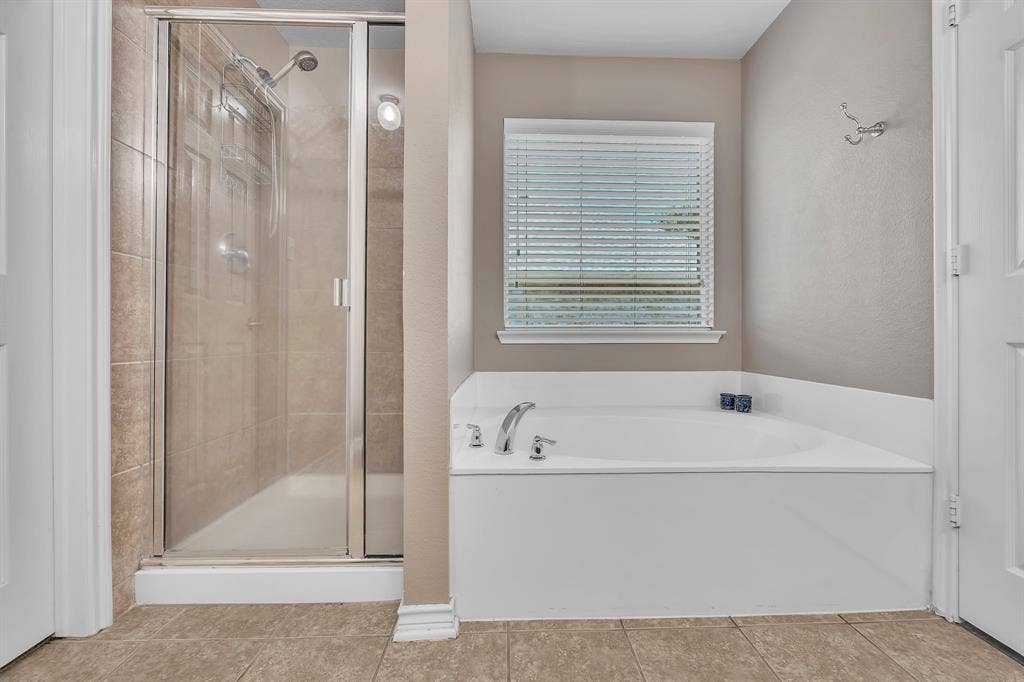 1201 Destiny Court, Wylie, TX 75098 Walk-in shower with clear glass enclosure and tile surround