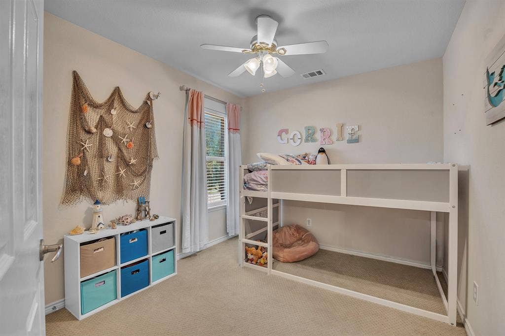 1201 Destiny Court, Wylie, TX 75098 Carpeted flooring, ceiling fan with integrated lighting, and window with blinds and drapes