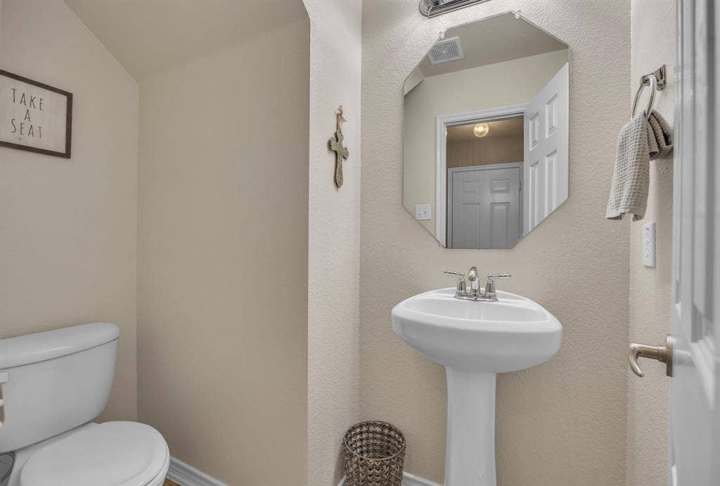 1201 Destiny Court, Wylie, TX 75098 Powder bathroom located on the main level.