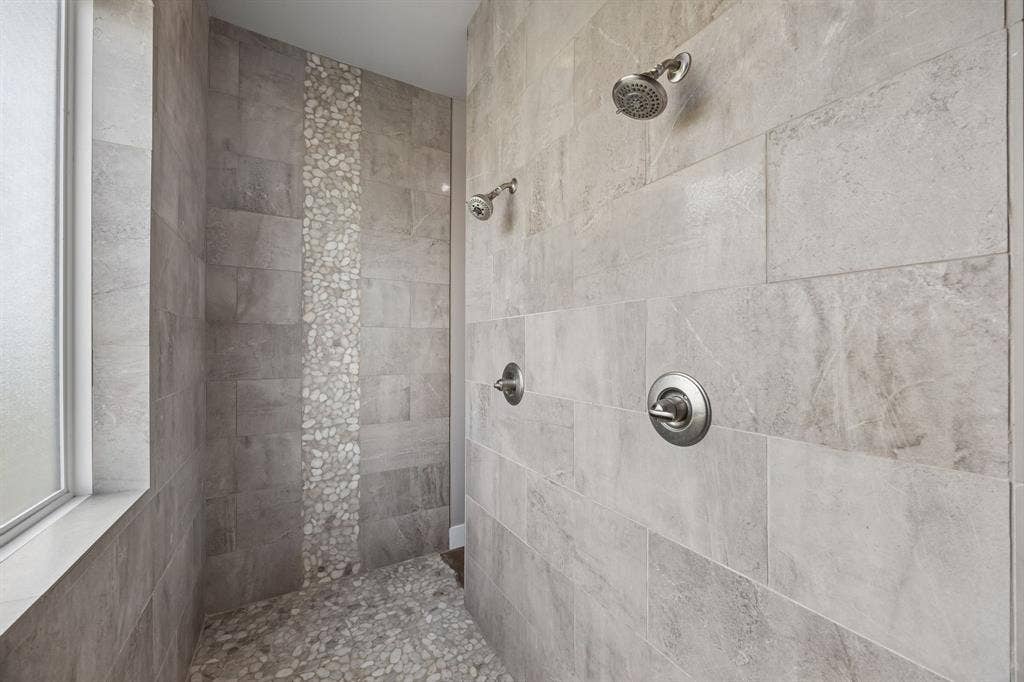 12961 County Road 574, Farmersville, TX 75442 Oversized shower with duel heads and 2 entry points with beautiful stone and tile work