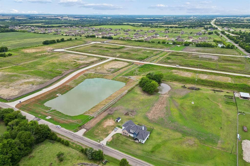 12961 County Road 574, Farmersville, TX 75442 past the pond is new construction homes for the Trails of Blue Ridge however no HOA on this home!