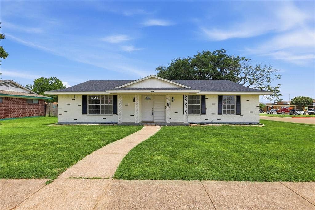 3301 Hillsdale Lane, Garland, TX 75042 Single-story residence featuring a white brick facade and dark shutters