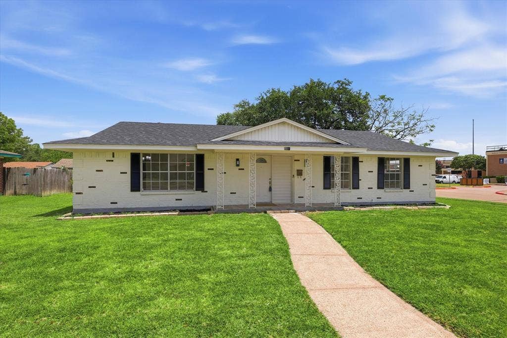 3301 Hillsdale Lane, Garland, TX 75042 Single-story residence featuring a white brick exterior and a dark shingle roof