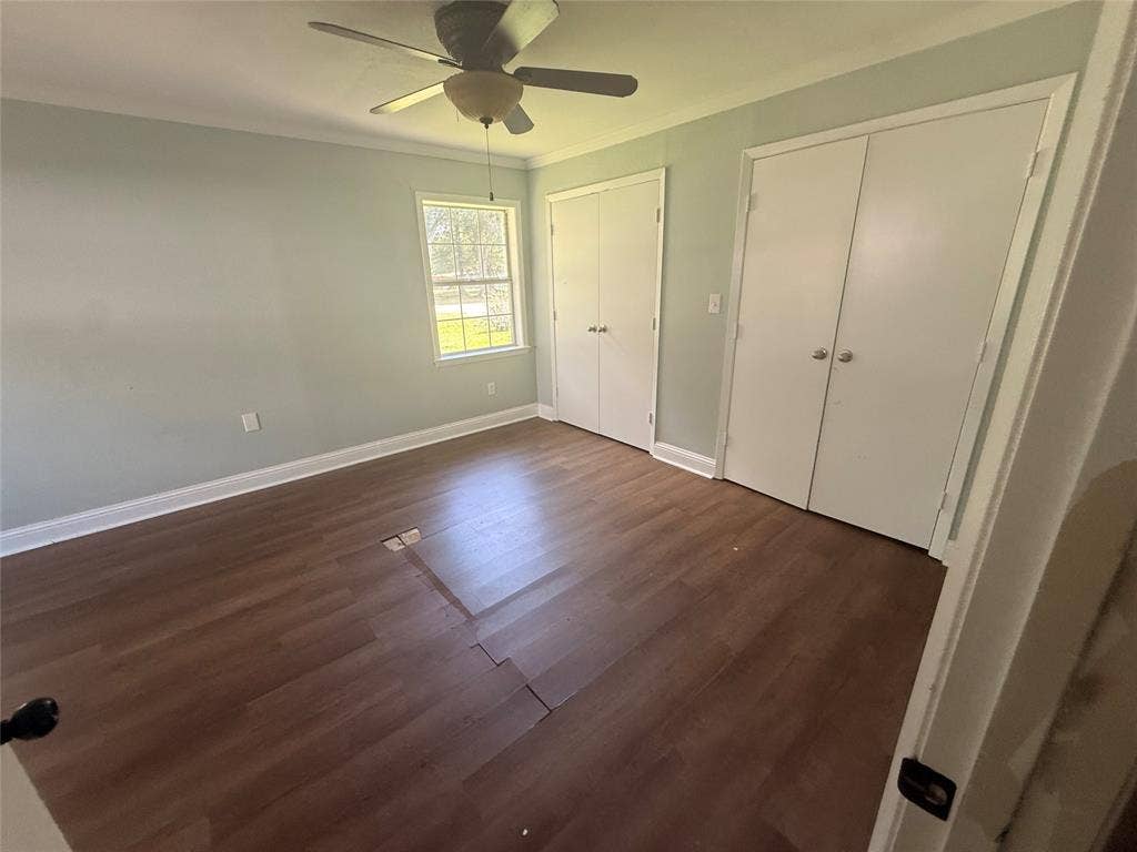 209 Lone Star Road, Trinidad, TX 75163 Room with two double-door closets and a window
