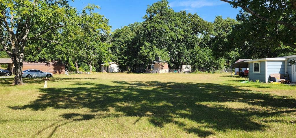 TBD Lot 282 Lide Lane, Tool, TX 75143 Expansive grass lot bordered by mature trees. Ready to build? This is the lot for you - Lot 282 Lide Lane and Bradleys Bend in Westwood Beach at Cedar Creek Lake.