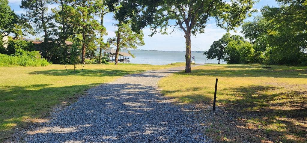 TBD Lot 282 Lide Lane, Tool, TX 75143 Road down to the lake at the Westwood Beach POA gated park. Join the voluntary POA to gain access to the boat ramp, park, and pier. Life is Better at the Lake.