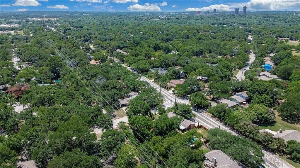 Expansive aerial perspective showcasing a verdant residential area