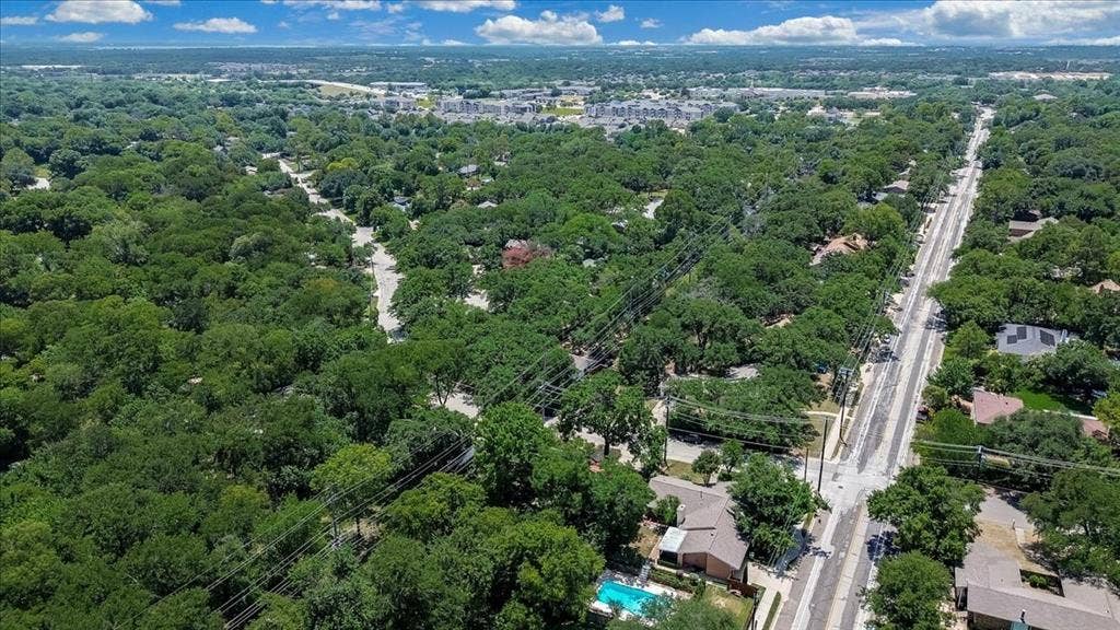 Expansive aerial panorama showcasing a tree-lined residential area
