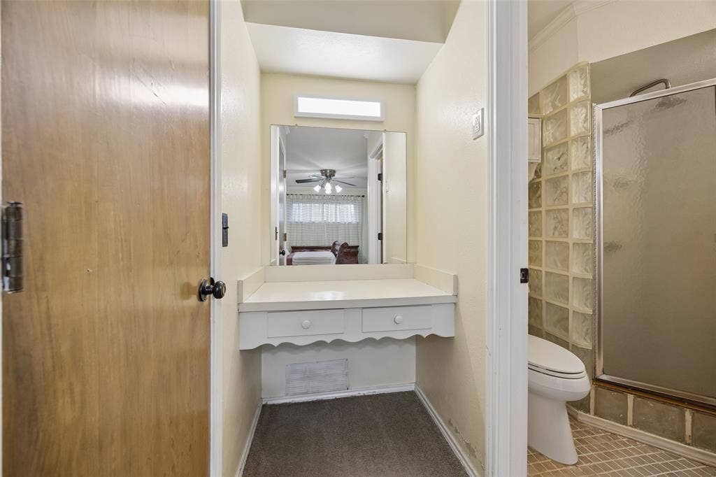 2104 Westlake Drive, Plano, TX 75075 Built-in vanity with mirror and overhead lighting