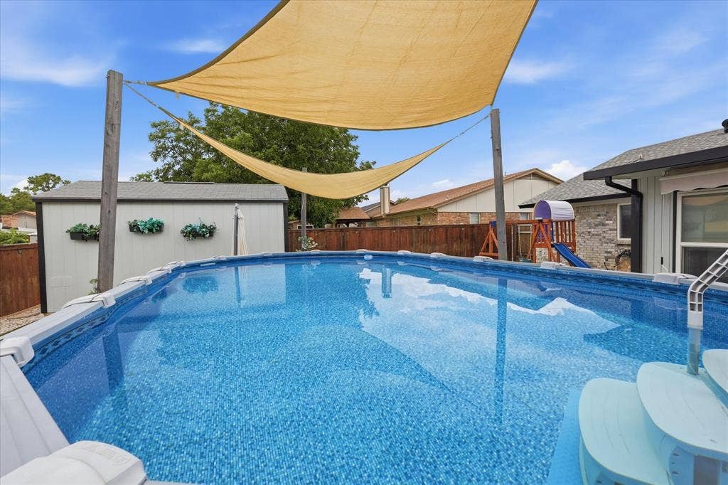 6572 Ridglea Drive, Watauga, TX 76148 Rectangular above-ground pool featuring a ladder for access