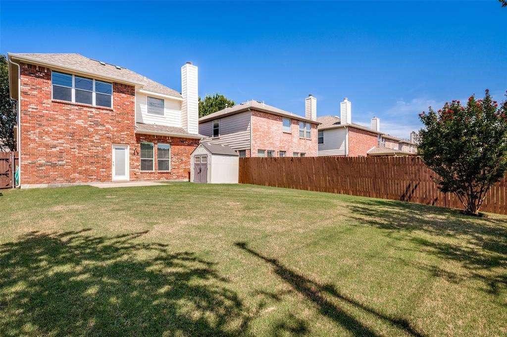 2113 Reston Drive, McKinney, TX 75072 Backyard with freshly stained fence