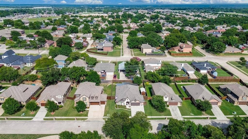 114 Lyndhurst Drive, Wylie, TX 75098 Aerial perspective showcasing a residential neighborhood with numerous single-story homes