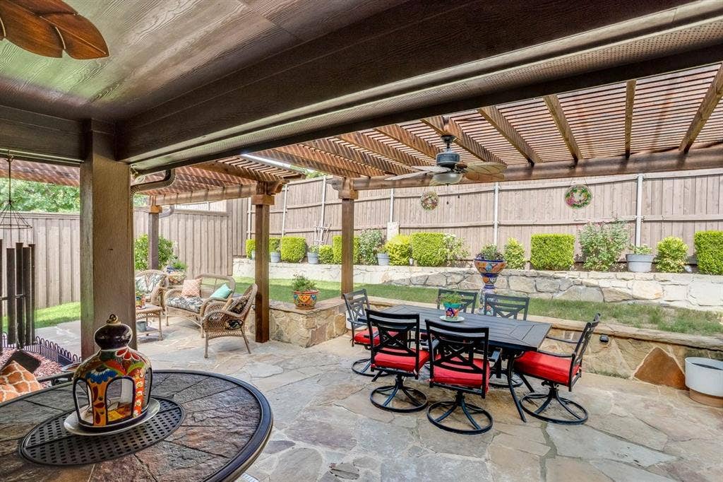 114 Lyndhurst Drive, Wylie, TX 75098 Expansive outdoor patio featuring flagstone paving, a wood ceiling with a ceiling fan, and a wood pergola extension