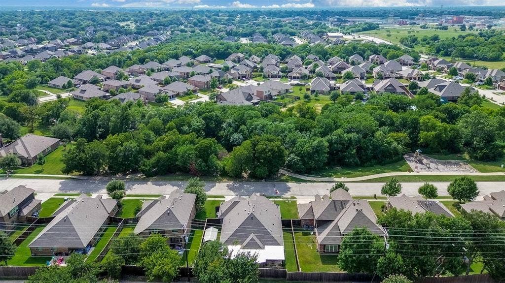 114 Lyndhurst Drive, Wylie, TX 75098 Aerial perspective highlighting residential properties with mature trees and green spaces