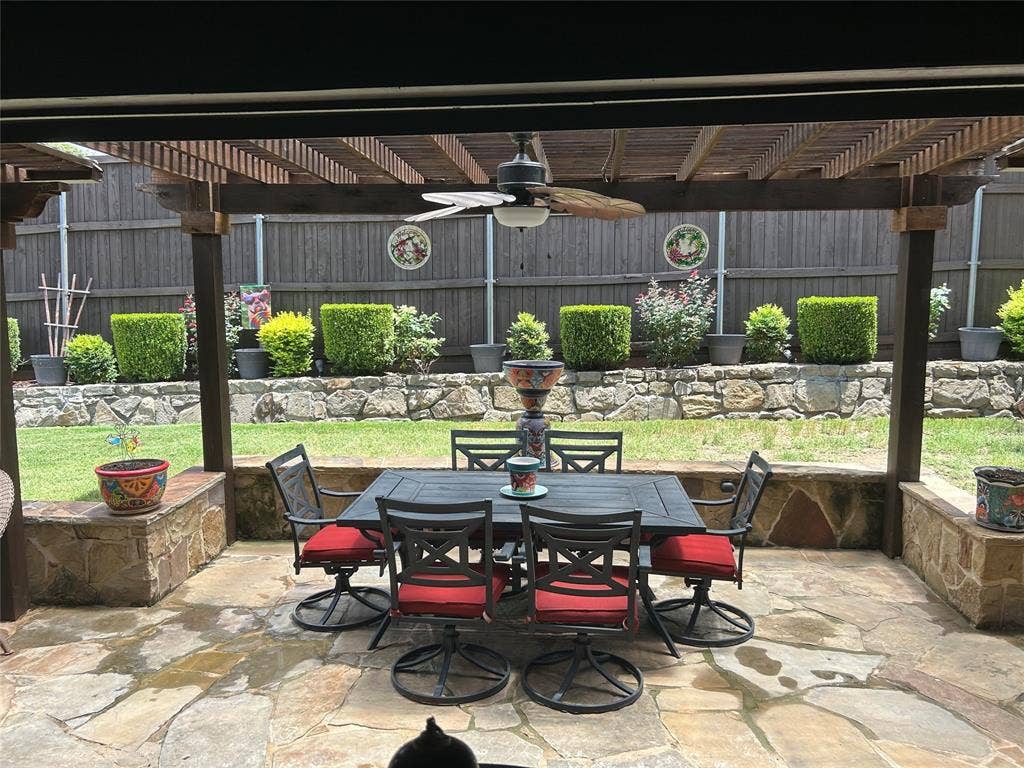 114 Lyndhurst Drive, Wylie, TX 75098 Covered patio featuring a wood pergola and ceiling fan