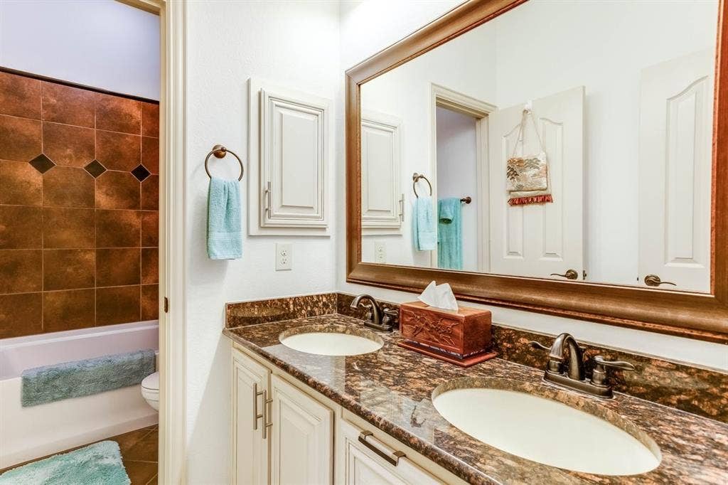 114 Lyndhurst Drive, Wylie, TX 75098 Dual vanity featuring stone countertops and two undermount sinks