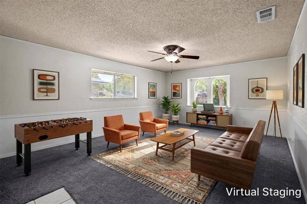 1315 Winding Brook Drive, DeSoto, TX 75115 Virtual staging showcasing a spacious room with carpet flooring, white paneled wainscoting, and multiple windows