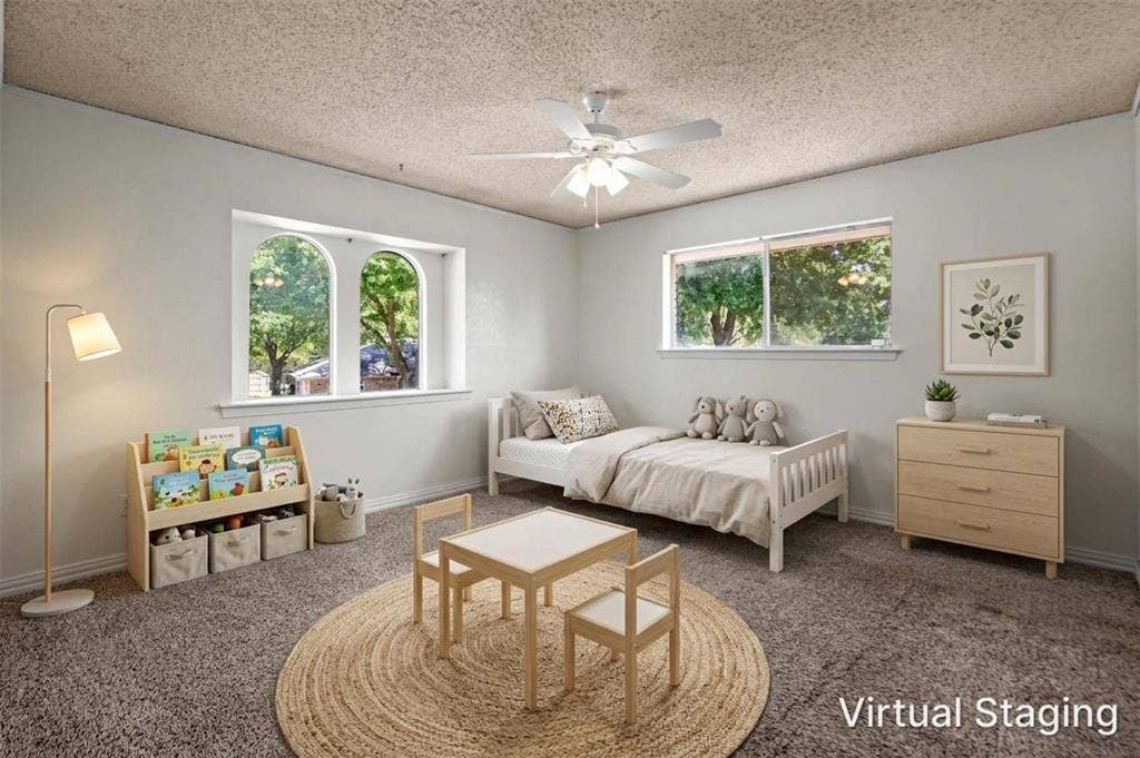 1315 Winding Brook Drive, DeSoto, TX 75115 Arched window accents, ceiling fan with light, and light-colored wall finishes