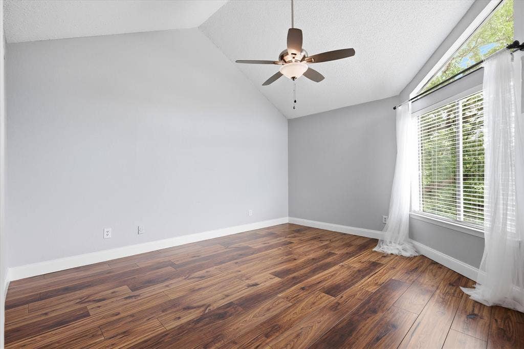 5550 Spring Valley Road, #A31, Dallas, TX 75254 Vaulted ceilings featuring a ceiling fan with integrated lighting